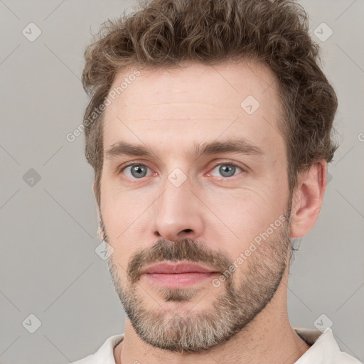 Neutral white young-adult male with short  brown hair and grey eyes