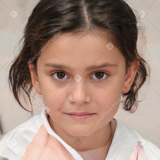 Joyful white child female with medium  brown hair and brown eyes