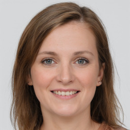 Joyful white young-adult female with medium  brown hair and grey eyes