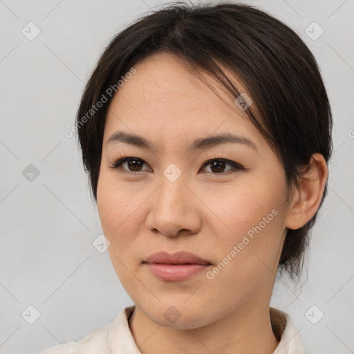 Joyful asian young-adult female with medium  brown hair and brown eyes