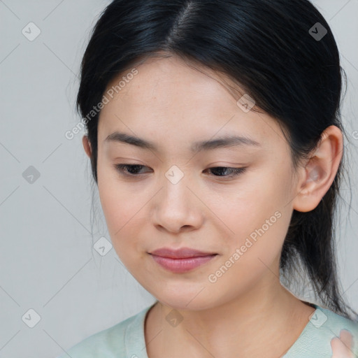 Joyful asian young-adult female with medium  brown hair and brown eyes