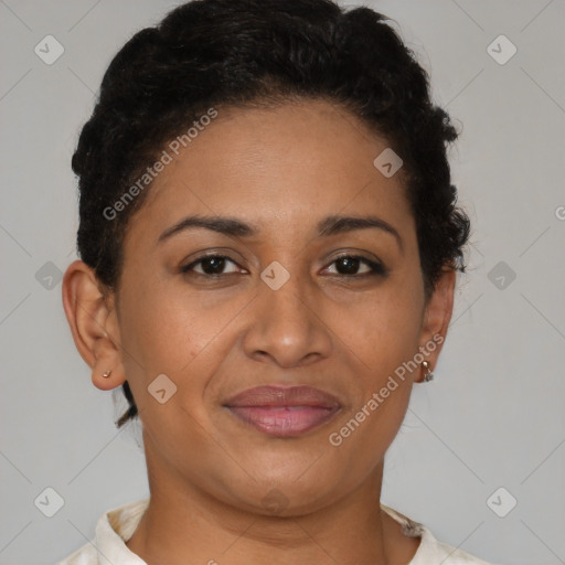 Joyful latino adult female with short  brown hair and brown eyes