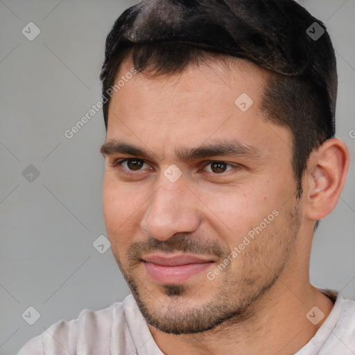 Joyful white adult male with short  brown hair and brown eyes