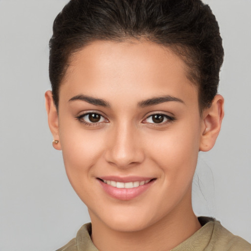 Joyful white young-adult female with short  brown hair and brown eyes