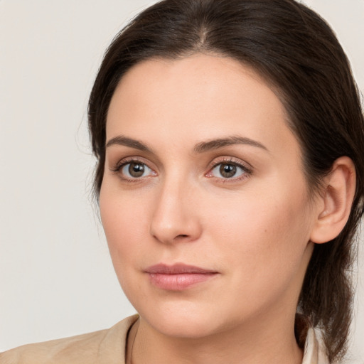 Neutral white young-adult female with medium  brown hair and brown eyes