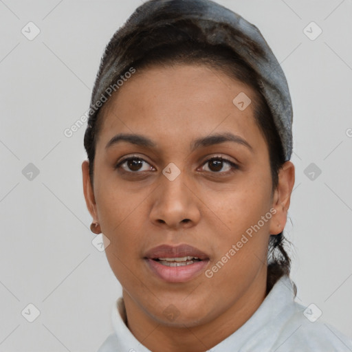 Joyful latino young-adult female with short  black hair and brown eyes