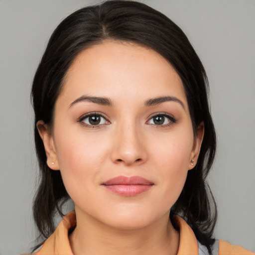 Joyful white young-adult female with medium  brown hair and brown eyes