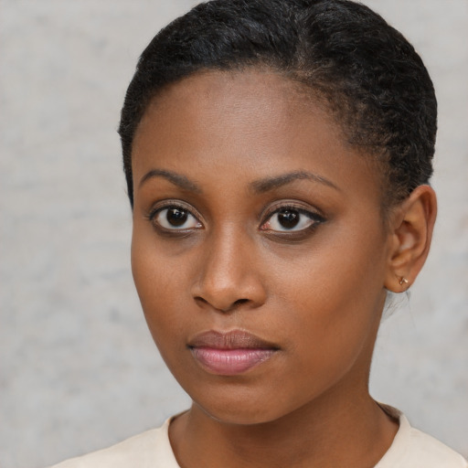 Neutral black young-adult female with short  brown hair and brown eyes