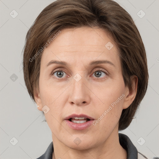 Neutral white adult female with short  brown hair and grey eyes