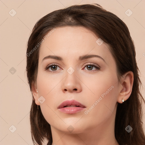 Neutral white young-adult female with long  brown hair and brown eyes