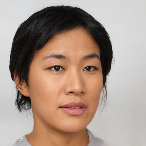Neutral asian young-adult female with medium  black hair and brown eyes