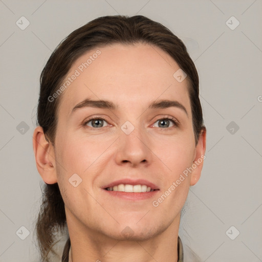 Joyful white adult male with short  brown hair and grey eyes