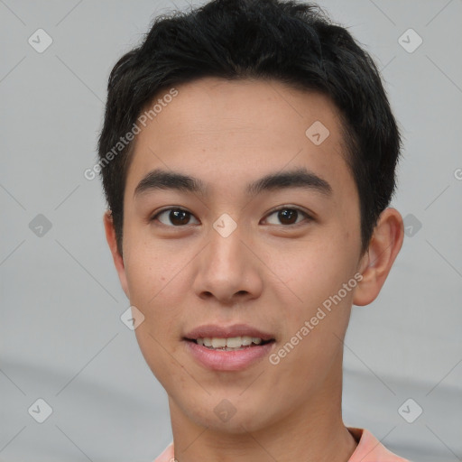 Joyful asian young-adult male with short  brown hair and brown eyes