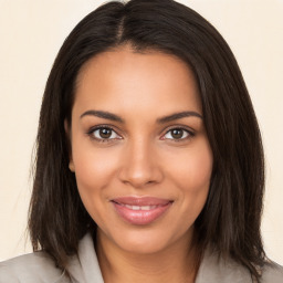 Joyful black young-adult female with medium  brown hair and brown eyes