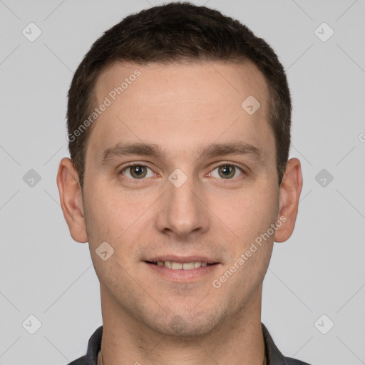 Joyful white young-adult male with short  brown hair and grey eyes