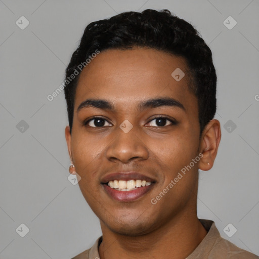 Joyful black young-adult male with short  black hair and brown eyes