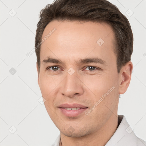 Joyful white young-adult male with short  brown hair and brown eyes