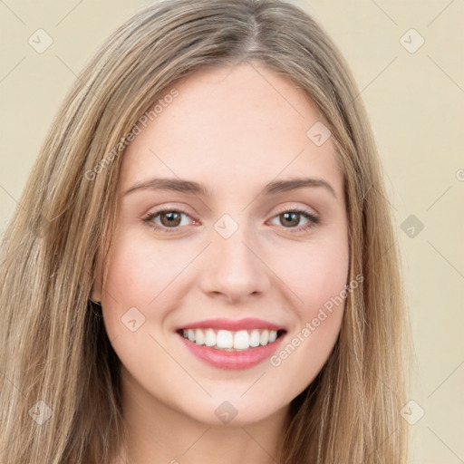 Joyful white young-adult female with long  brown hair and green eyes