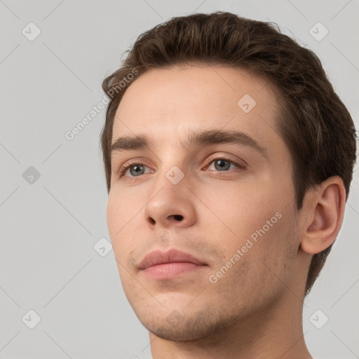 Neutral white young-adult male with short  brown hair and grey eyes