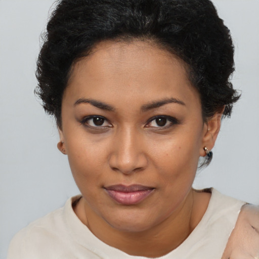Joyful latino young-adult female with short  brown hair and brown eyes