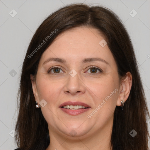 Joyful white adult female with long  brown hair and brown eyes