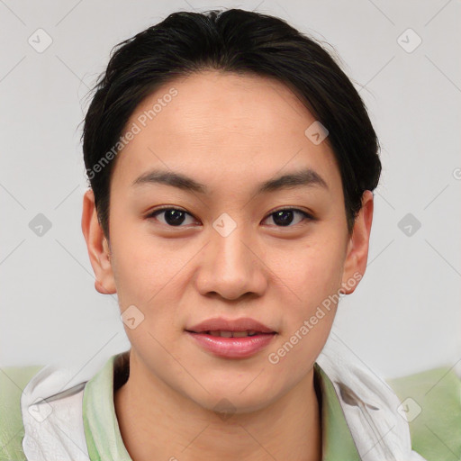 Joyful asian young-adult female with medium  brown hair and brown eyes