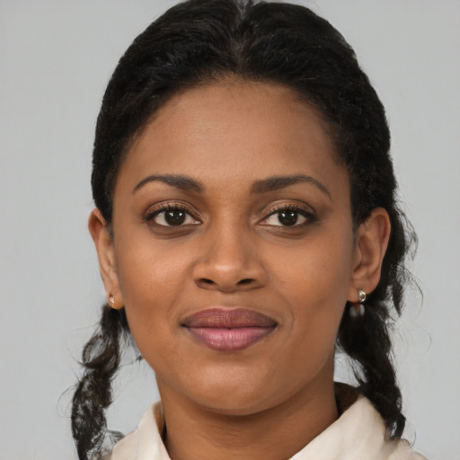 Joyful latino young-adult female with medium  black hair and brown eyes