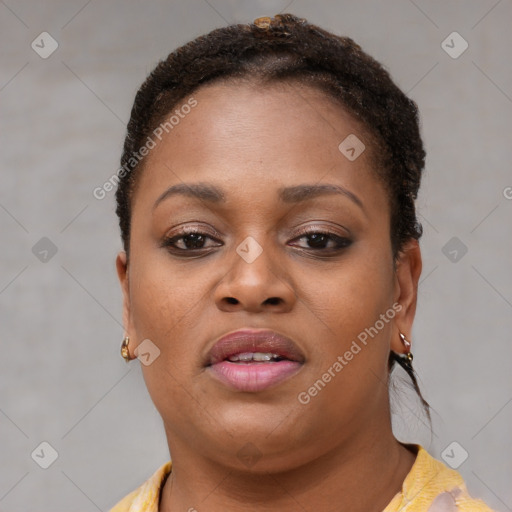 Joyful black young-adult female with short  brown hair and brown eyes