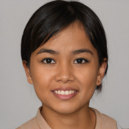 Joyful asian young-adult female with medium  black hair and brown eyes