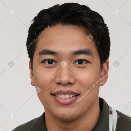 Joyful asian young-adult male with short  black hair and brown eyes