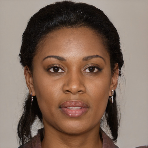 Joyful black young-adult female with medium  brown hair and brown eyes