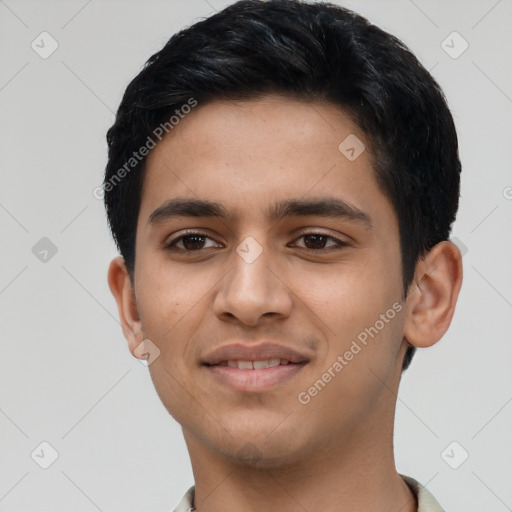 Joyful latino young-adult male with short  black hair and brown eyes