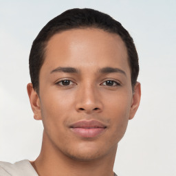 Joyful latino young-adult male with short  brown hair and brown eyes