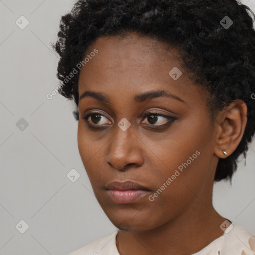 Neutral black young-adult female with short  brown hair and brown eyes