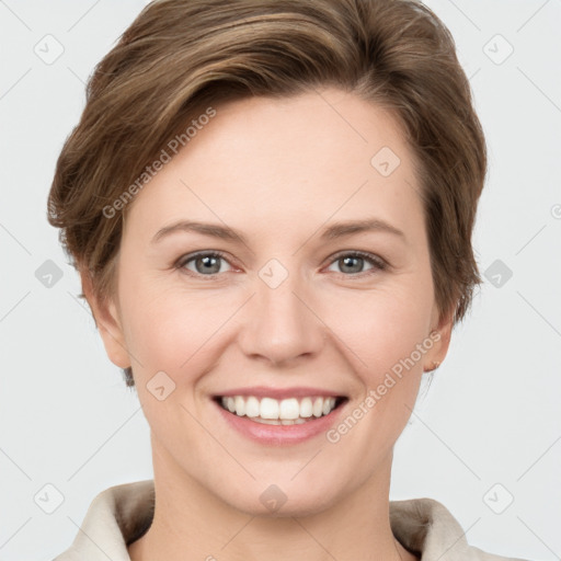 Joyful white young-adult female with short  brown hair and grey eyes