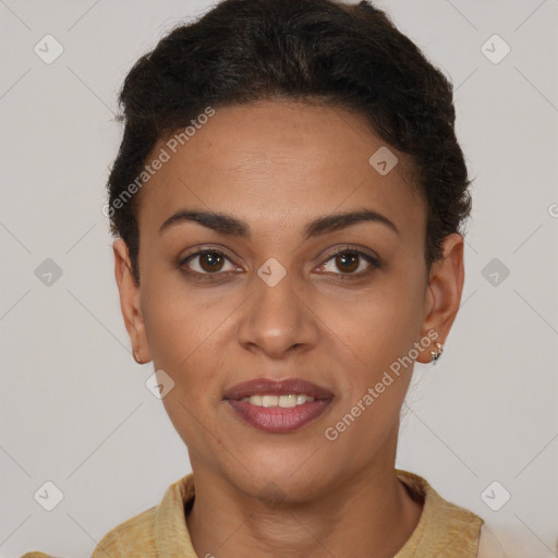 Joyful black young-adult female with short  brown hair and brown eyes