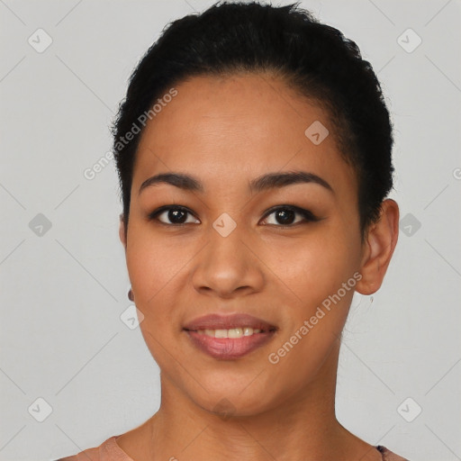 Joyful latino young-adult female with short  black hair and brown eyes