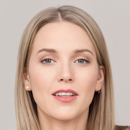 Joyful white young-adult female with long  brown hair and grey eyes