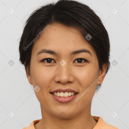 Joyful asian young-adult female with short  brown hair and brown eyes