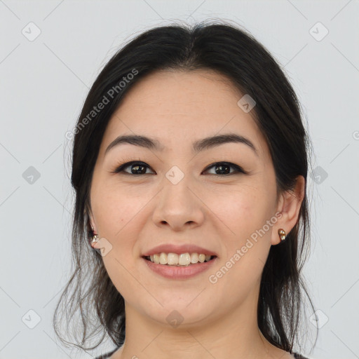 Joyful asian young-adult female with long  brown hair and brown eyes