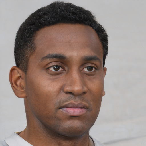 Neutral black young-adult male with short  brown hair and brown eyes