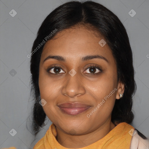 Joyful black young-adult female with medium  black hair and brown eyes