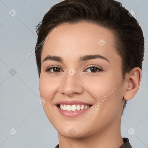 Joyful white young-adult female with short  brown hair and brown eyes