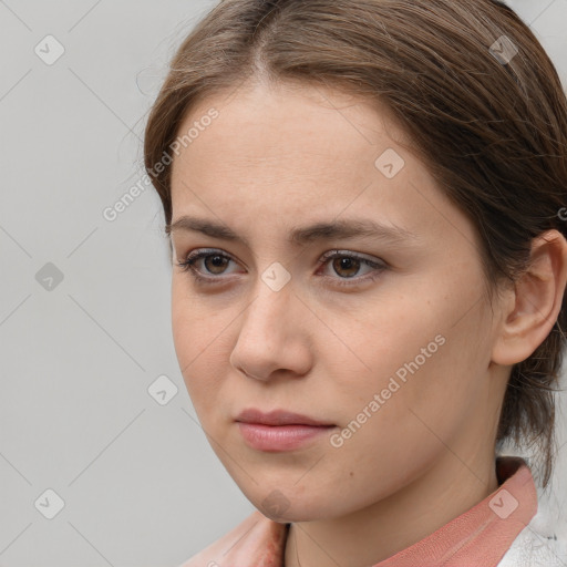 Neutral white young-adult female with medium  brown hair and brown eyes