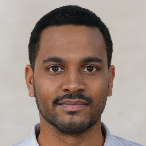 Neutral black young-adult male with short  black hair and brown eyes