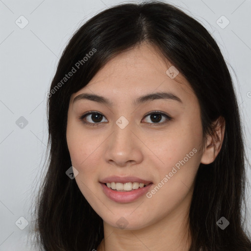 Joyful asian young-adult female with long  brown hair and brown eyes