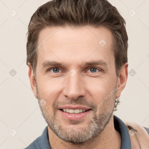 Joyful white adult male with short  brown hair and grey eyes