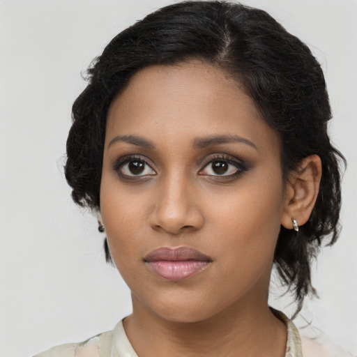 Neutral black young-adult female with long  brown hair and brown eyes