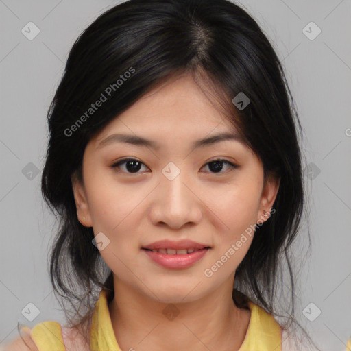 Joyful asian young-adult female with medium  black hair and brown eyes