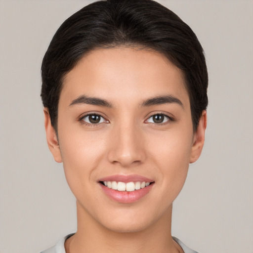 Joyful white young-adult female with short  brown hair and brown eyes